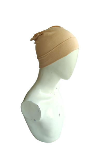Beige headscarf on a mannequin head against a white background