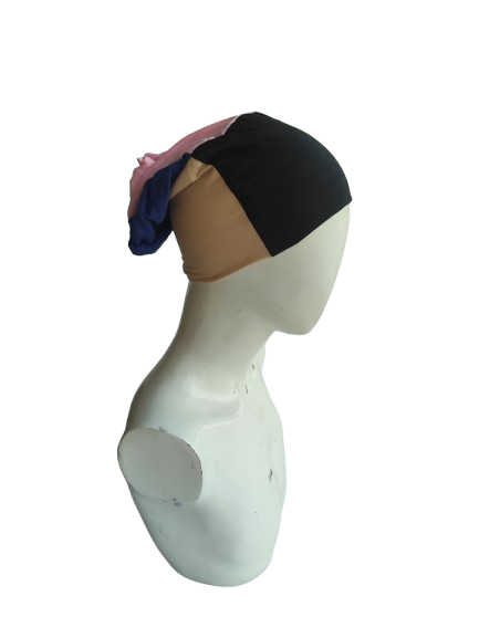 Mannequin head with colorful headscarf on a white background