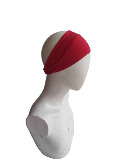 Red headband on a mannequin head against a white background